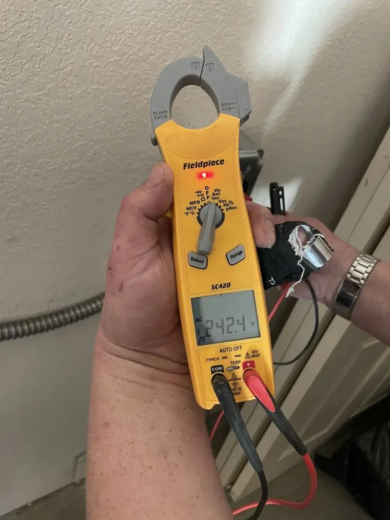 Voltage testing with clamp meter during Circuit Breaker Repair in Monroe
